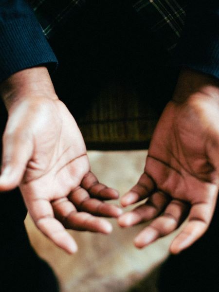 Demonstrate prayer posture of open hands